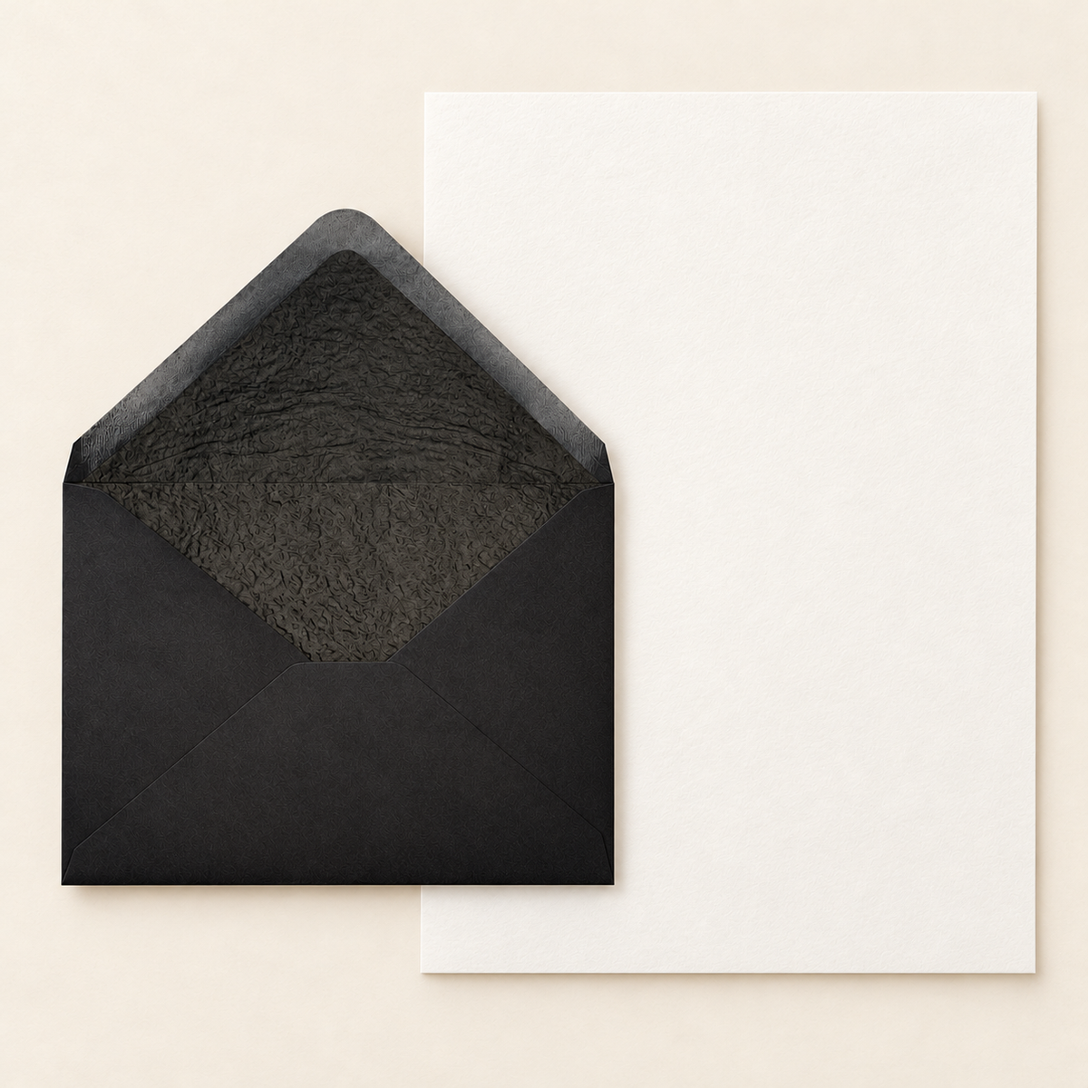 Black C5 black-lined envelope with one full unfolded cotton writing sheet